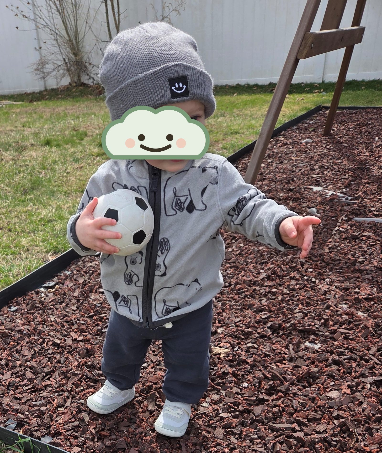Baby exploring outdoors with a soft beanie at Nurture and Grow
